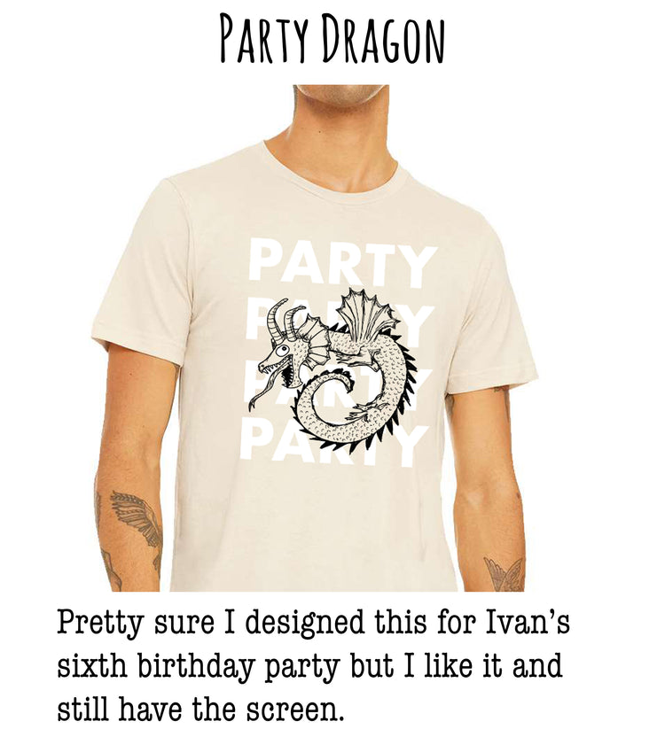 A person wearing a beige t-shirt with a graphic of a dragon and the text "PARTY DRAGON" printed on it.