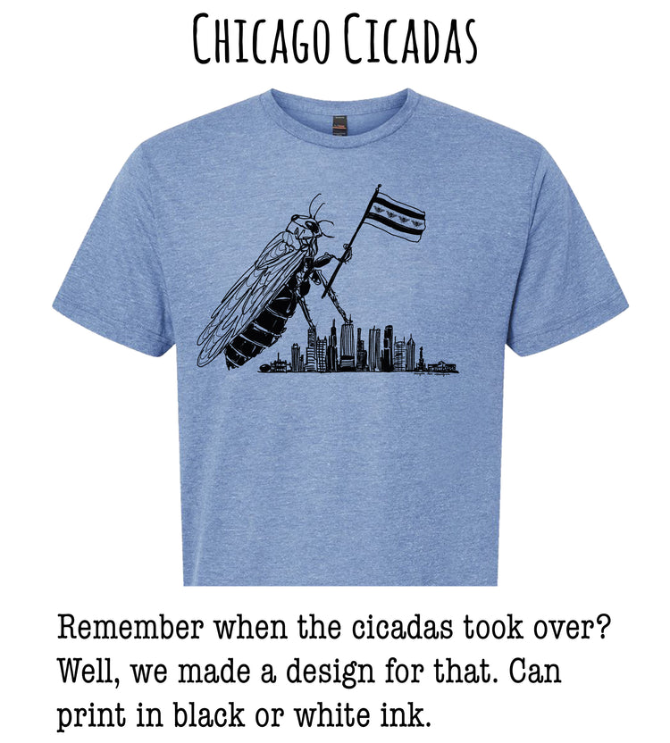 A blue t-shirt with a graphic design depicting a large cicada holding a Chicago flag, with a cityscape in the background.