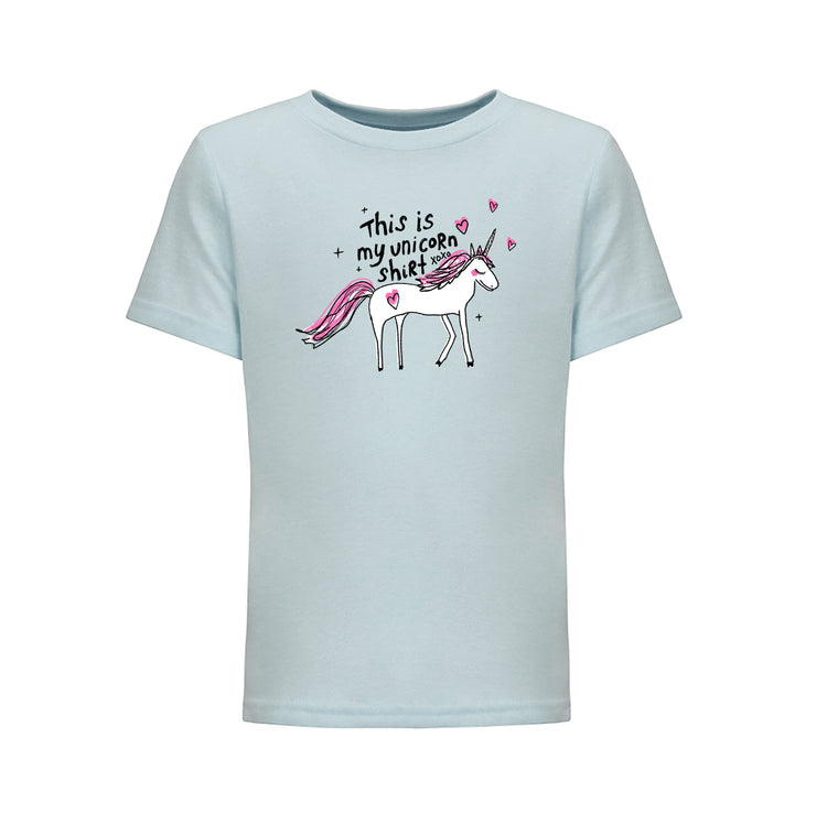 A light blue t-shirt with a cartoon illustration of a white unicorn and the text "This is my unicorn shirt" printed on it.