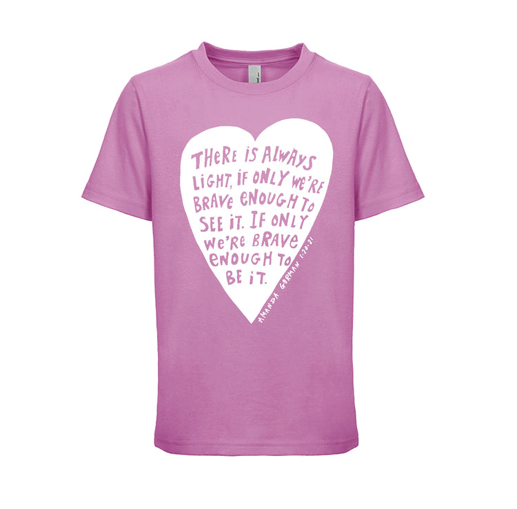 The image is a pink t-shirt with a white heart-shaped graphic and text printed on it.
