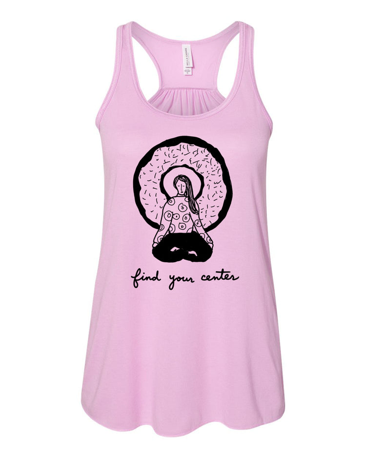 A pink tank top with a graphic design of a woman sitting in a meditative pose, surrounded by a circular pattern resembling a donut. The text below the graphic says "find your center".