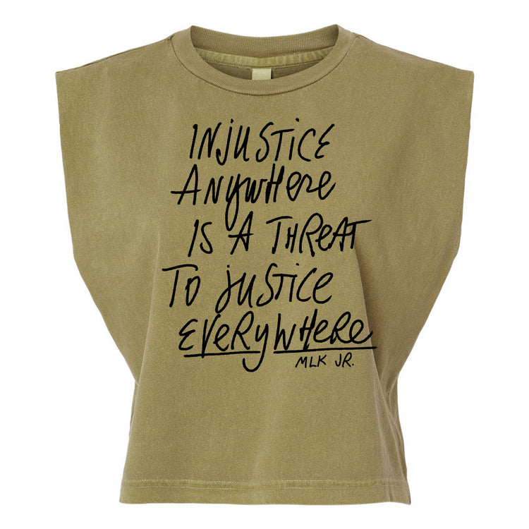 a beige t-shirt with a printed message that reads "Injustice anywhere is a threat to justice everywhere" and the name "MLK JR."