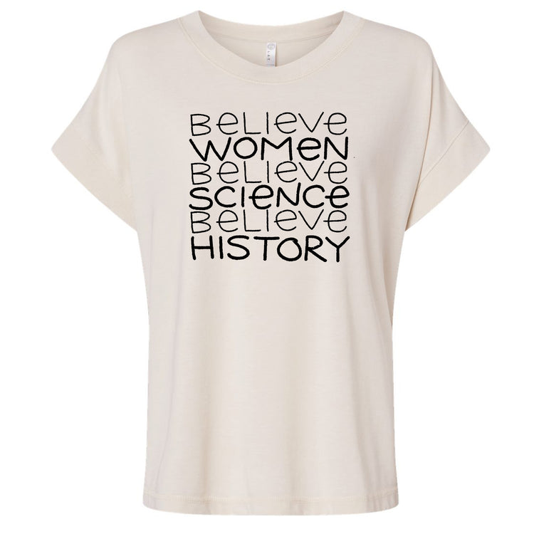 A white t-shirt with the text "Believe Women Believe Science Believe History" printed on it in a blocky font.