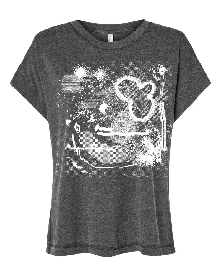 The image is a gray t-shirt with a white abstract design featuring various shapes and patterns.