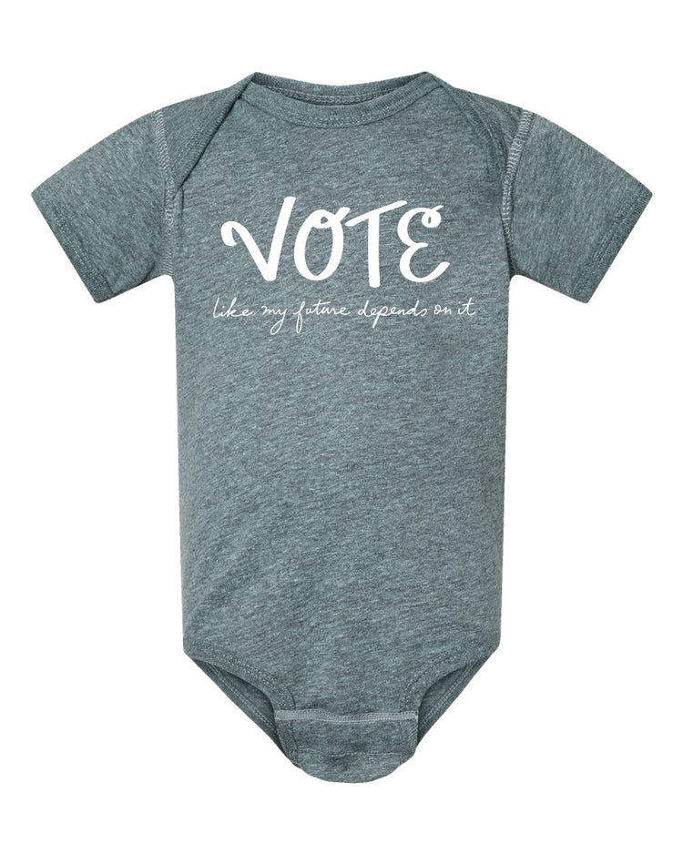 A gray baby onesie with the text "VOTE like my future depends on it" printed on it.