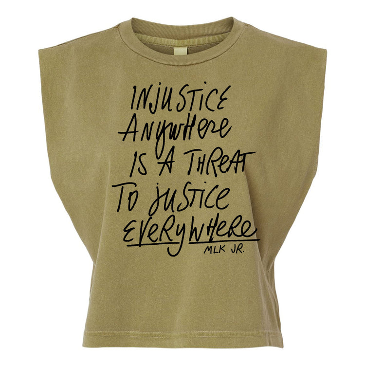 a beige t-shirt with a printed message that reads "Injustice anywhere is a threat to justice everywhere" and the name "MLK JR."