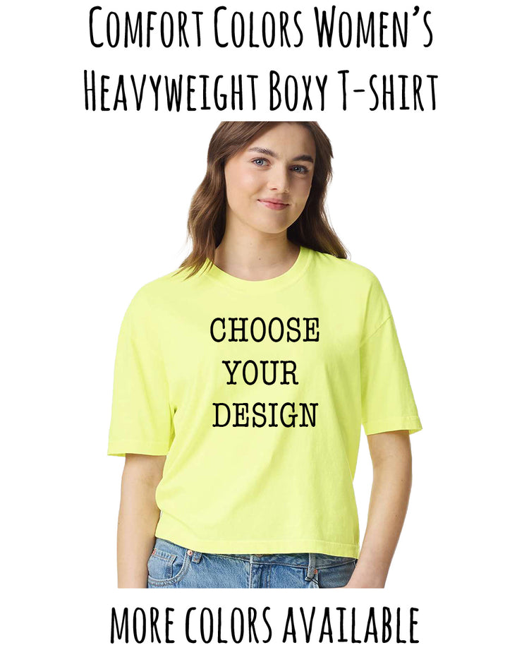 A woman wearing a yellow t-shirt with the text "CHOOSE YOUR DESIGN" printed on it, smiling at the camera.