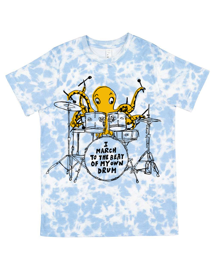 A blue and white tie-dye t-shirt with an illustration of an octopus playing a drum set and the text "I march to the beat of my own drum" printed on it.