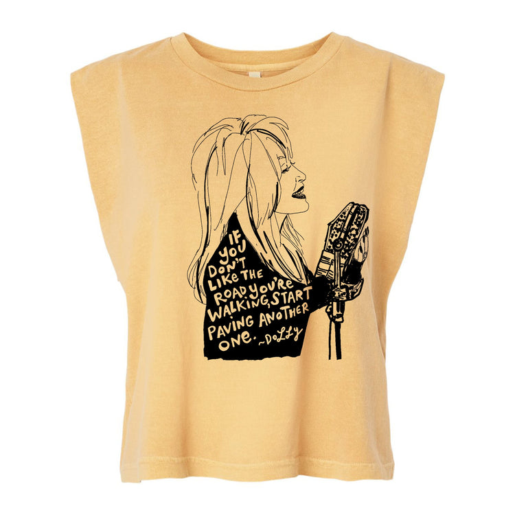 a t-shirt with a graphic design depicting a woman with long hair and a microphone. The text on the t-shirt reads "If you don't like the road you're on, start walking another one."