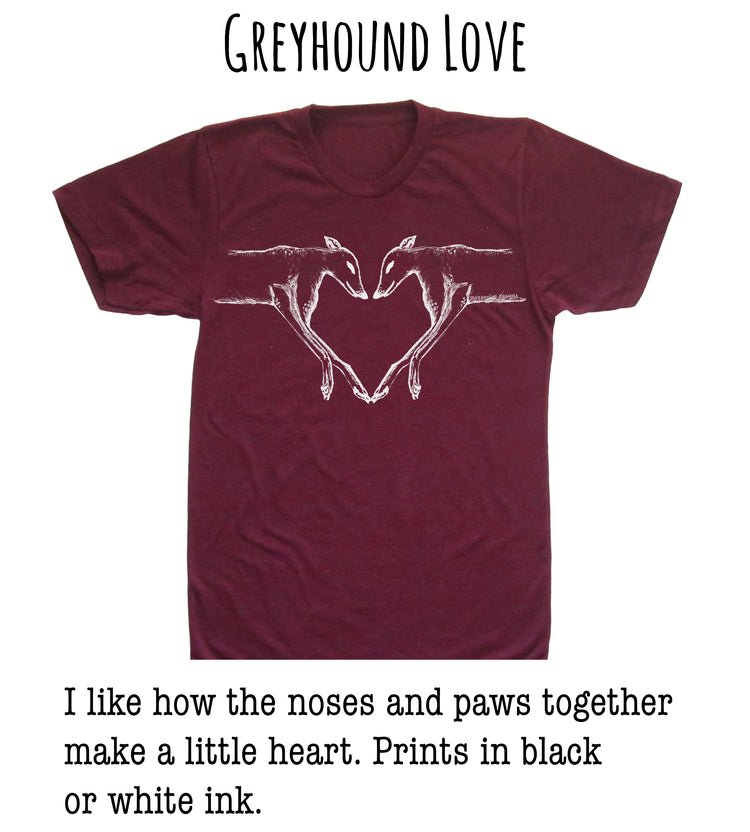 A burgundy t-shirt with a white graphic design depicting two greyhound dogs forming a heart shape.