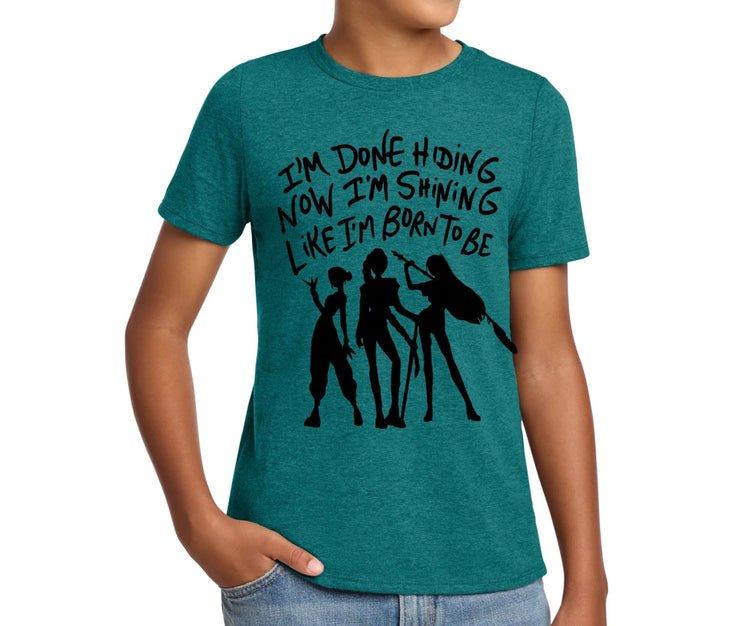 A young boy wearing a green t-shirt with a graphic design and text printed on it.