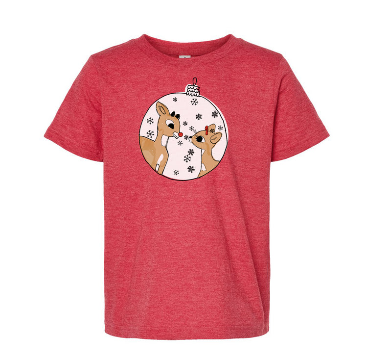 a red t - shirt with a christmas ornament on it