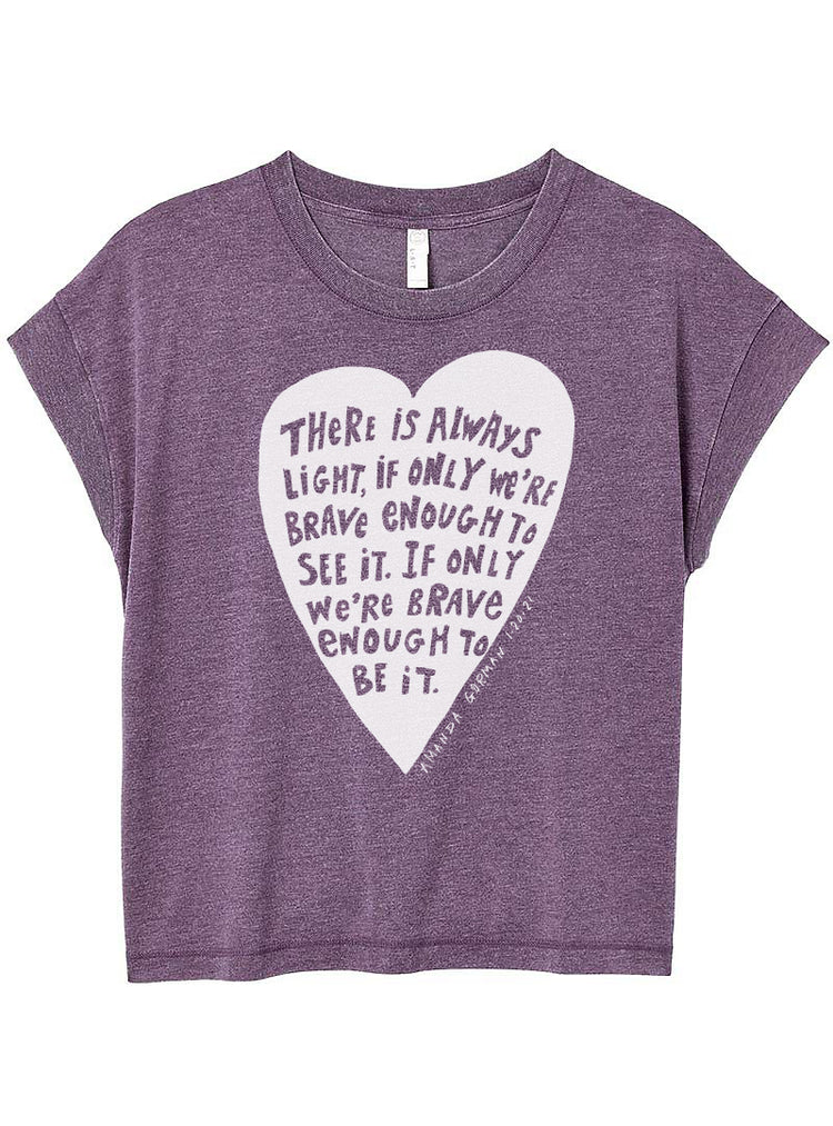 The image is a purple t-shirt with a white heart-shaped graphic and text printed on it.