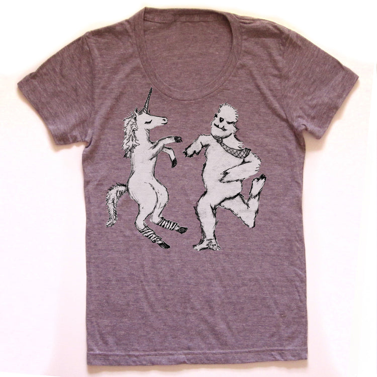 A gray t-shirt with a graphic design depicting a unicorn and a creature resembling a bear or similar animal.