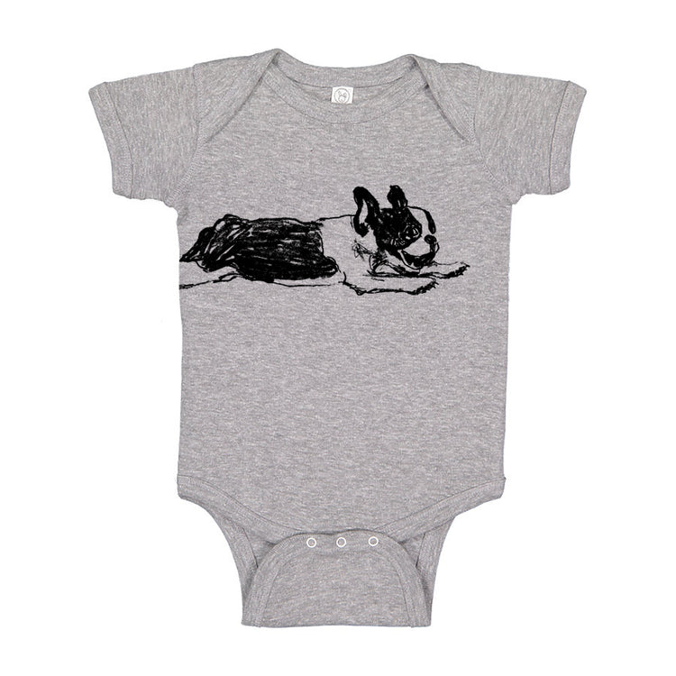A grey onesie with a black and white drawing of a dog on it.