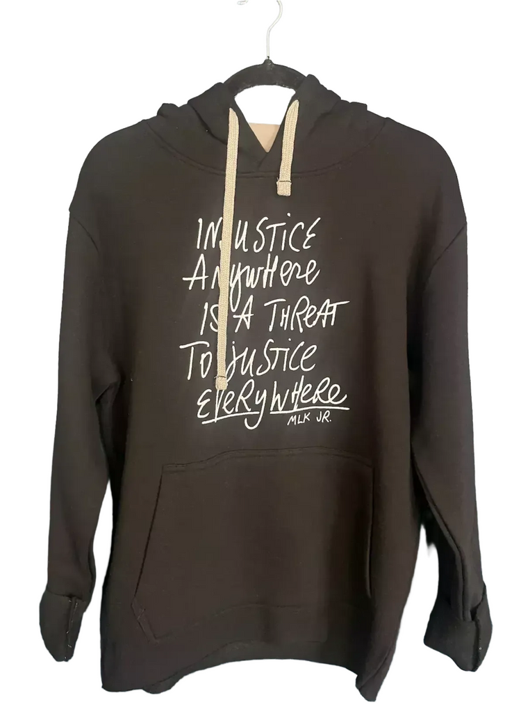 A black hoodie with white text printed on it.