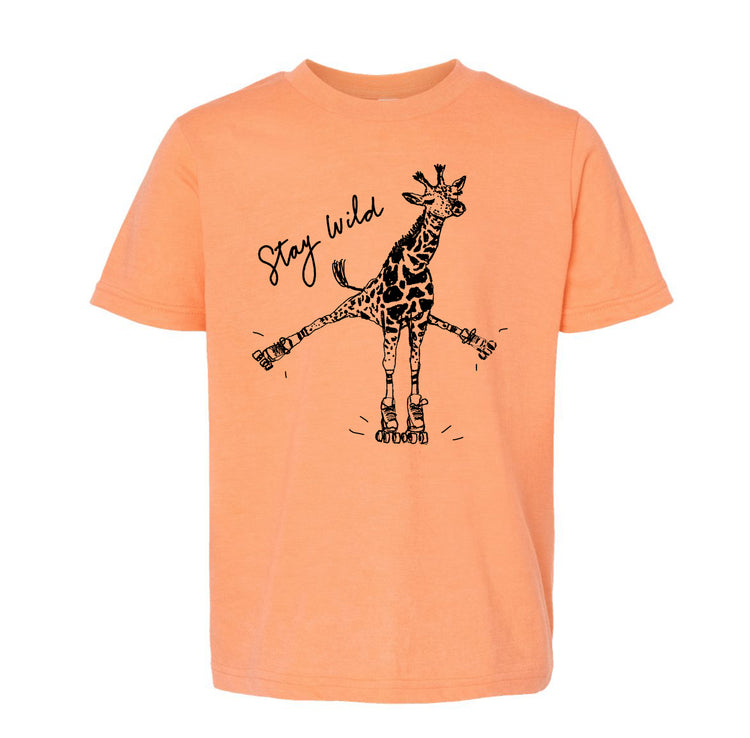 a t-shirt with a graphic design of a giraffe on roller skates, accompanied by the text "Stay wild".