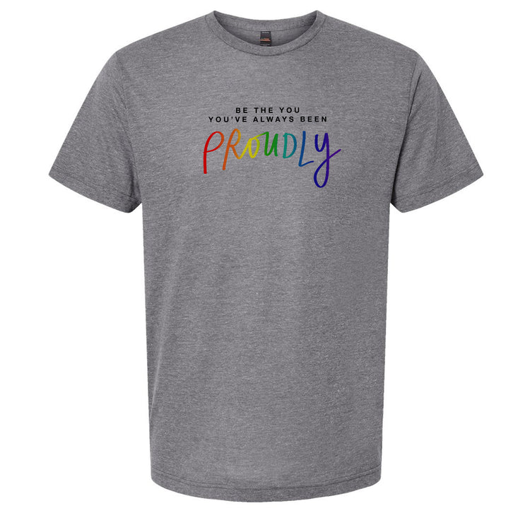 A gray t-shirt with the text "Be the you, you've always been proudly" printed on it.