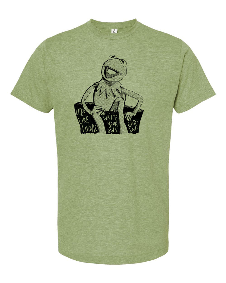 A green t-shirt with a black and white graphic of Kermit the Frog sitting on a couch and the text "Life like a movie" printed on it.