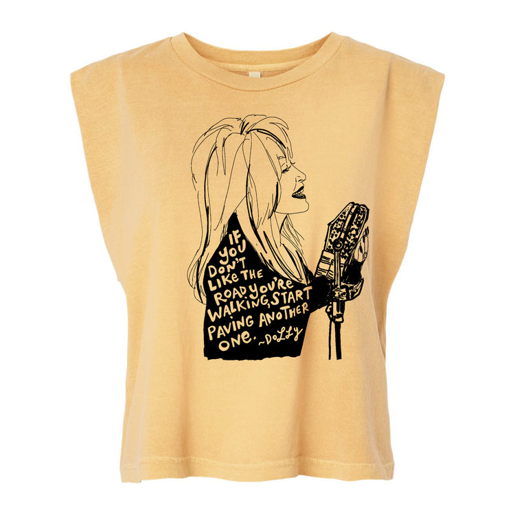 a t-shirt with a graphic design depicting a woman with long hair and a microphone. The text on the t-shirt reads "If you don't like the road you're on, start walking another one."