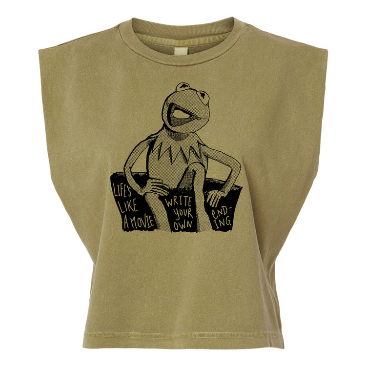 A t-shirt with a graphic design featuring a frog character and text that reads "Lives like a movie, write your own, ending -ing".