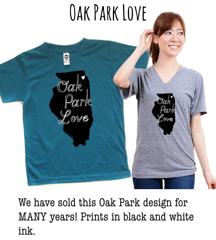 a woman wearing a grey t-shirt with a black graphic design of the state of Illinois, along with the text "Oak Park Love". The woman is smiling and posing for the camera.