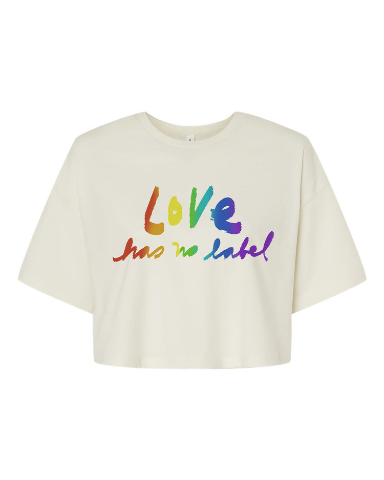A white crop top with the text "Love has no label" printed on it in a rainbow color scheme.