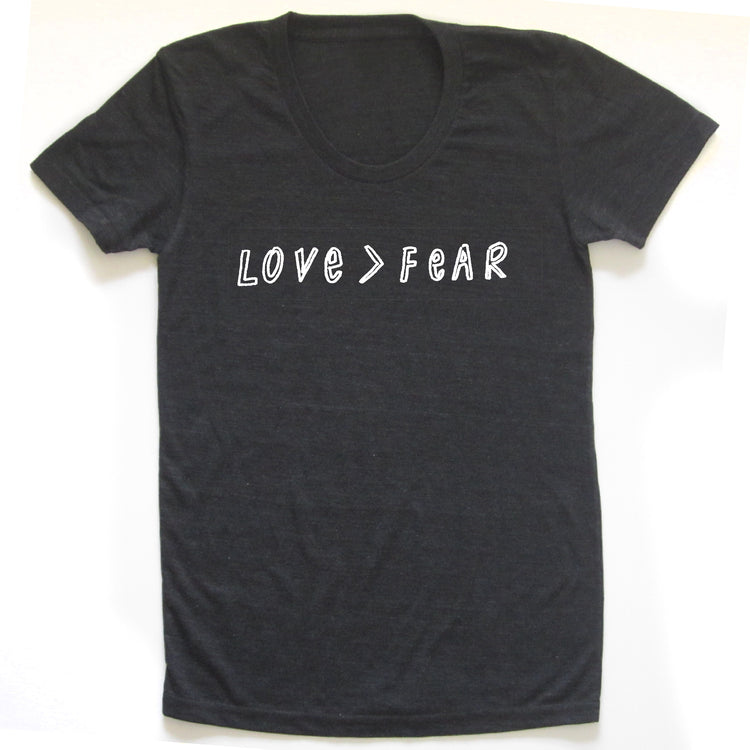 A black t-shirt with the text "LOVE=FEAR" printed on it in white letters.