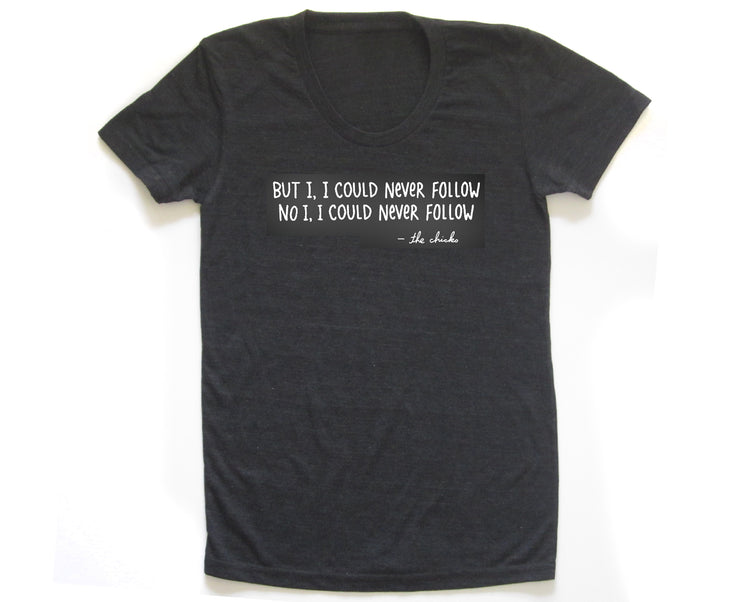 A black t-shirt with a white text message printed on it.