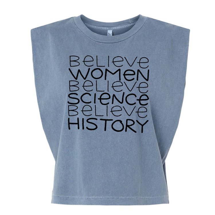 A gray t-shirt with the text "Believe Women Believe Science Believe History" printed on it.
