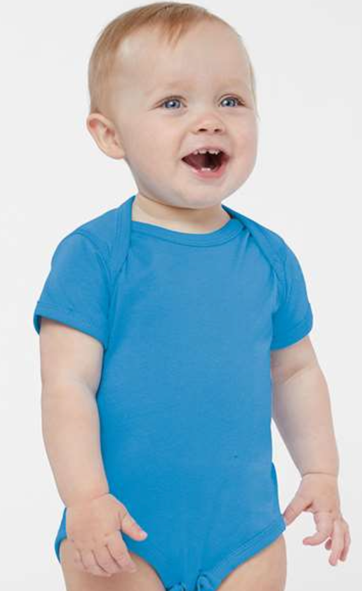 a baby wearing a blue bodysuit and smiling