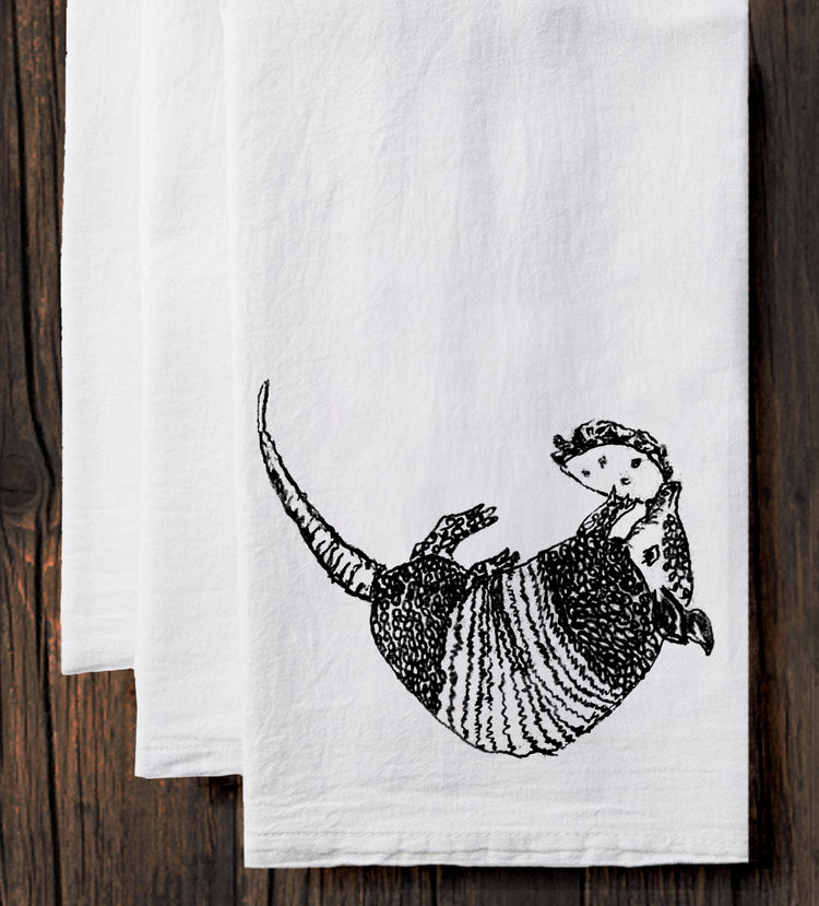 a towel with a picture of a man riding a dinosaur on it