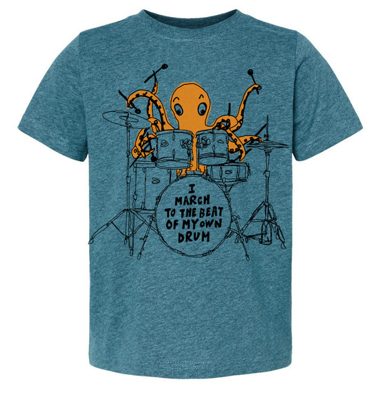 An orange octopus playing a drum set on a t-shirt.