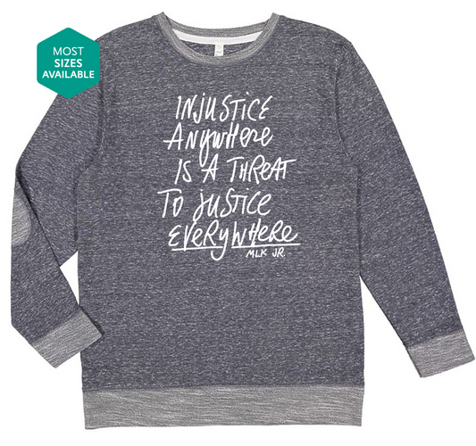 a grey sweatshirt with white writing on it