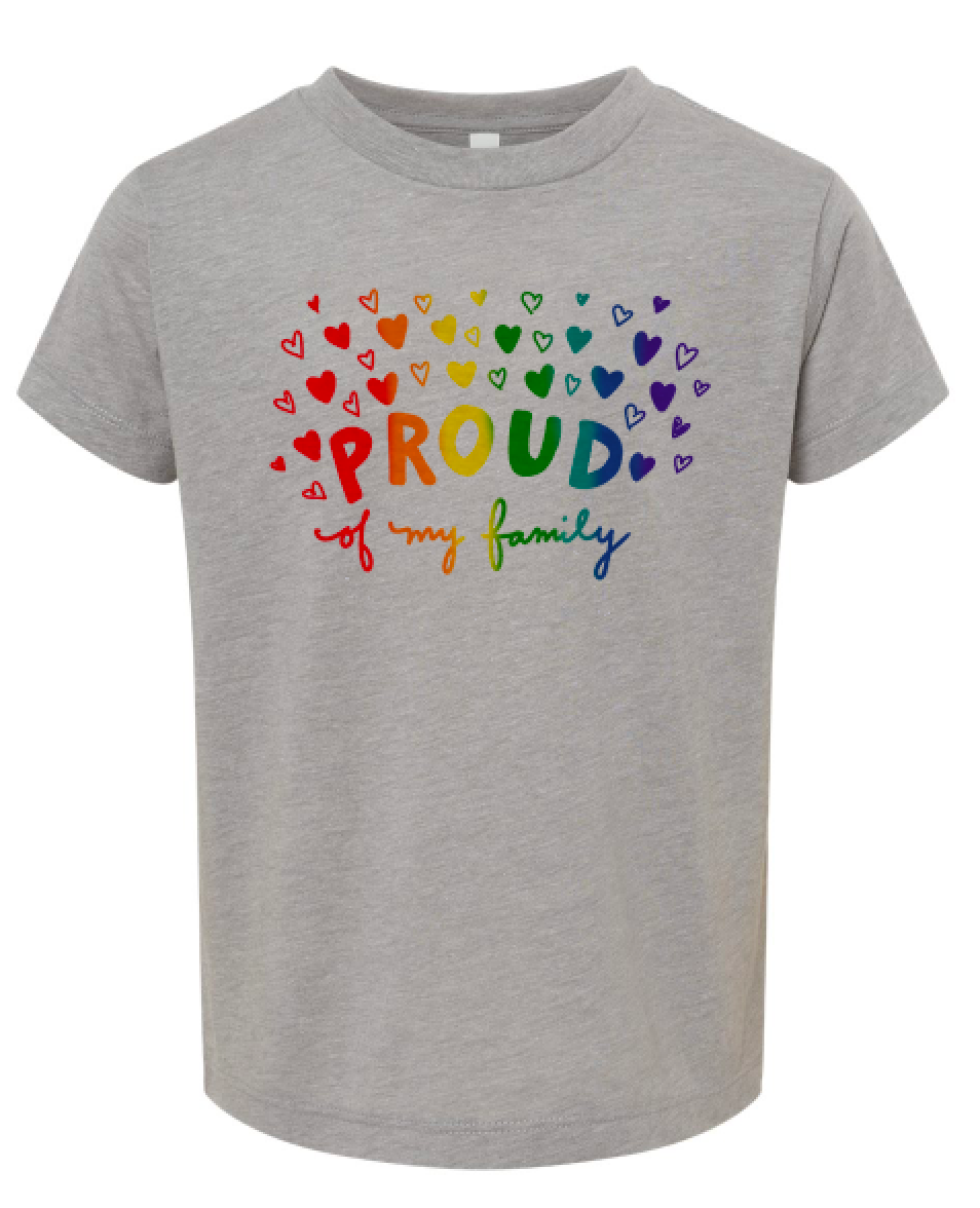 A gray t-shirt with a colorful graphic design featuring the word "PROUD" surrounded by hearts in various colors.