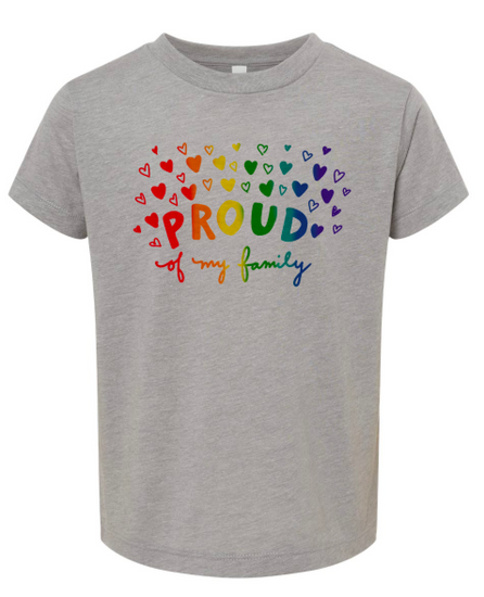 A gray t-shirt with a colorful graphic design featuring the word "PROUD" surrounded by hearts in various colors.