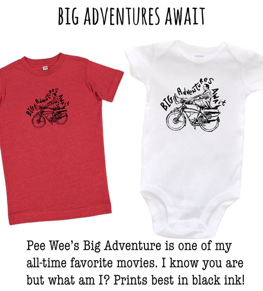 two children's shirts, one red and one white, with a bicycle graphic and the text "Big Adventures Await" printed on them.
