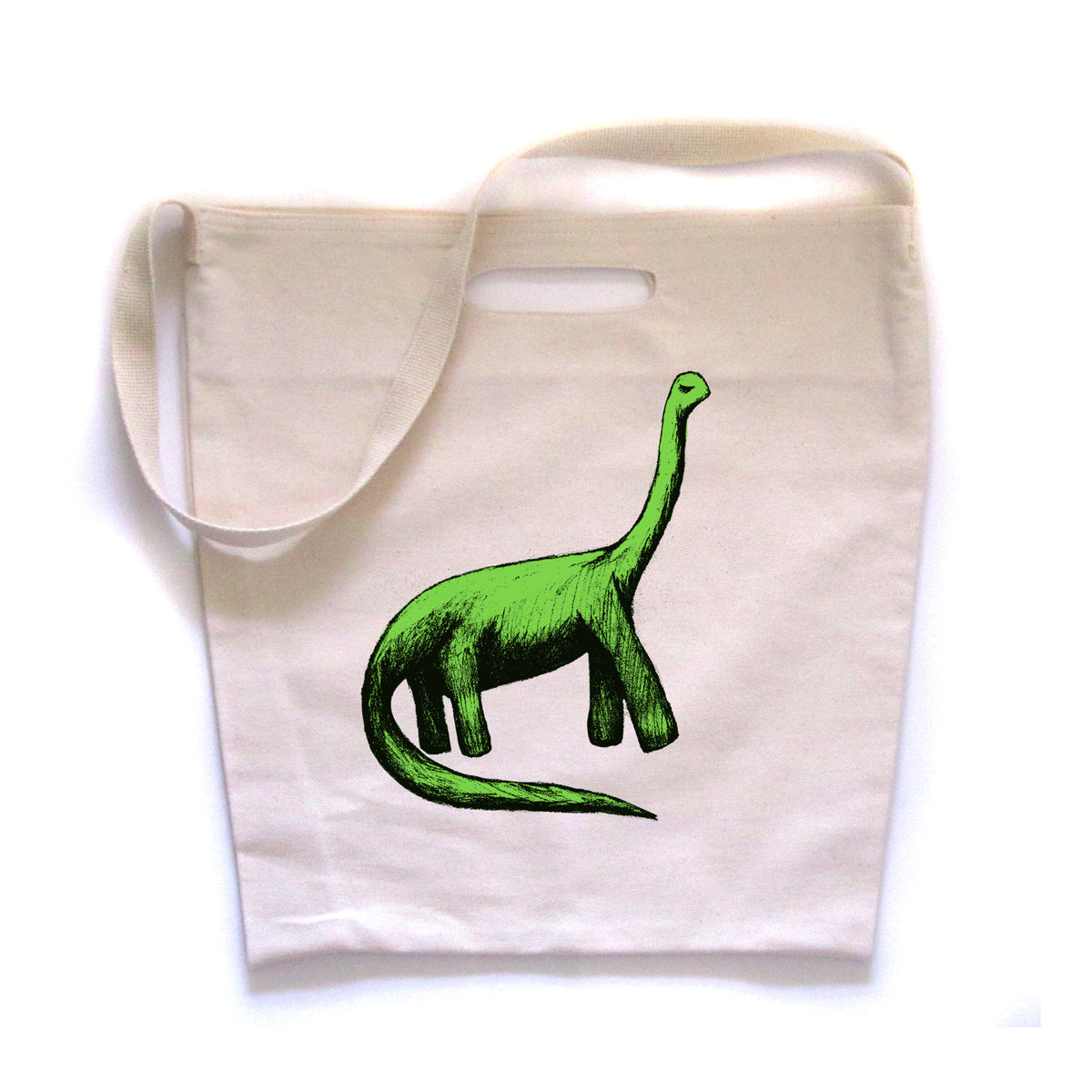 A white tote bag with a green dinosaur illustration printed on it.