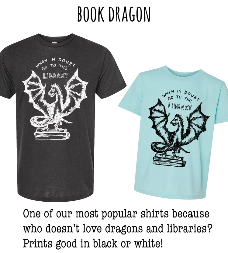 two shirts with a dragon design, one black and one light blue, both with the text "Book Dragon" printed on them.