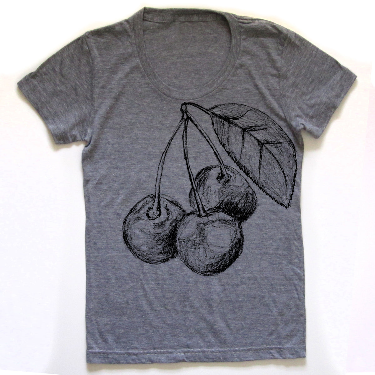A gray t-shirt with a black and white drawing of cherries and a leaf on the front.