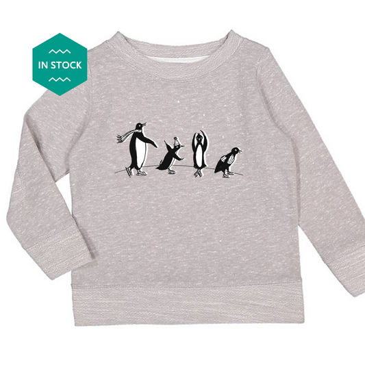 a long sleeved shirt with penguins on it