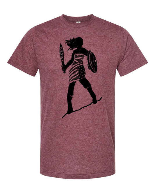 A graphic t-shirt design featuring a silhouette of a person holding a shield and sword, with the word "RESIST" written on the shield.