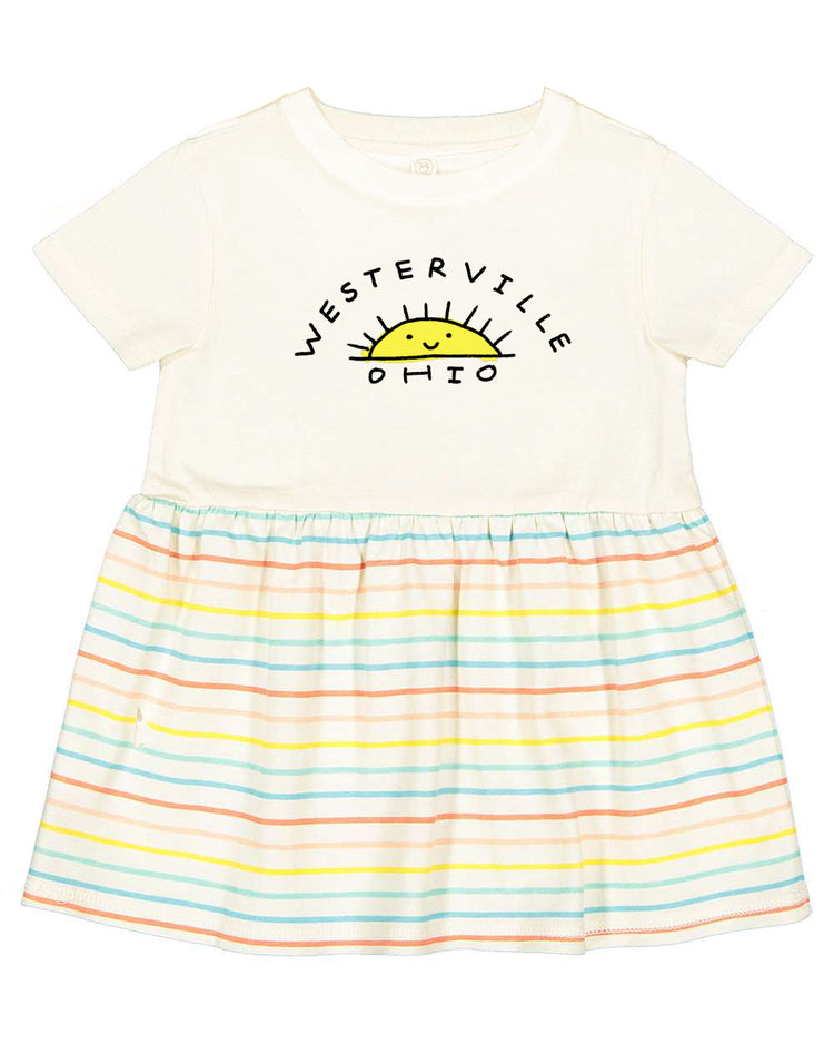 A white t-shirt with a graphic design and a striped skirt.