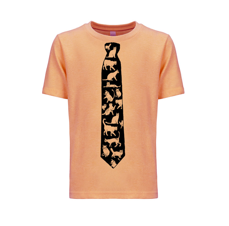 a peach-colored t-shirt with a black tie printed on it, depicting a pattern of cats.