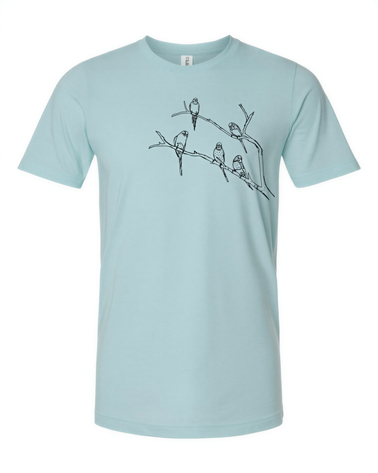 A light blue t-shirt with a black and white graphic design depicting a group of birds perched on a branch.