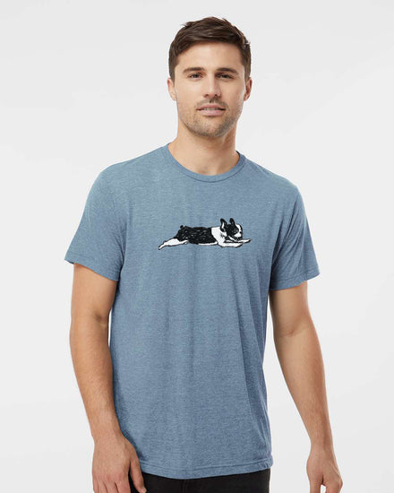 A man wearing a blue t-shirt with a graphic of a dog on it.