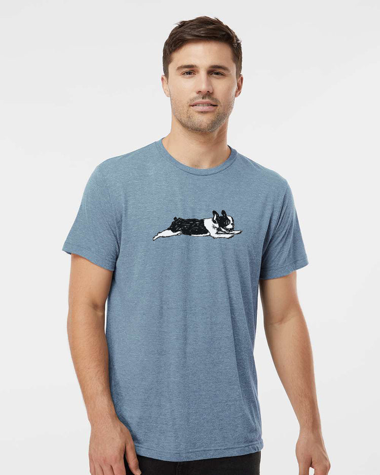 A man wearing a blue t-shirt with a graphic of a dog on it.