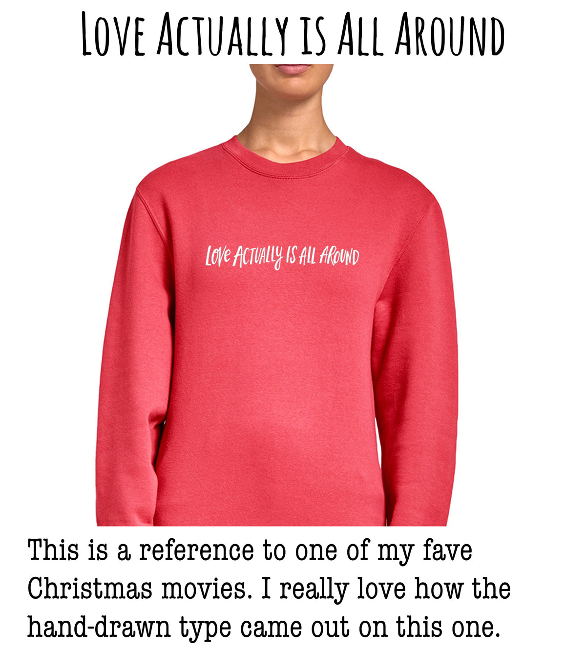 A person wearing a red sweater with the text "Love actually is all around" printed on it.