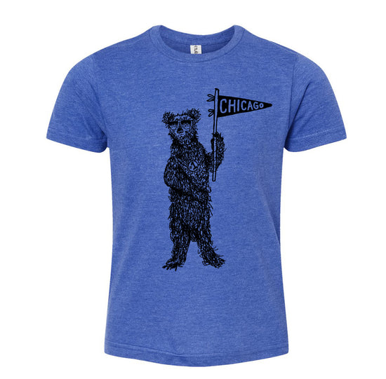 A blue t-shirt with a graphic design of a bear holding a Chicago flag.