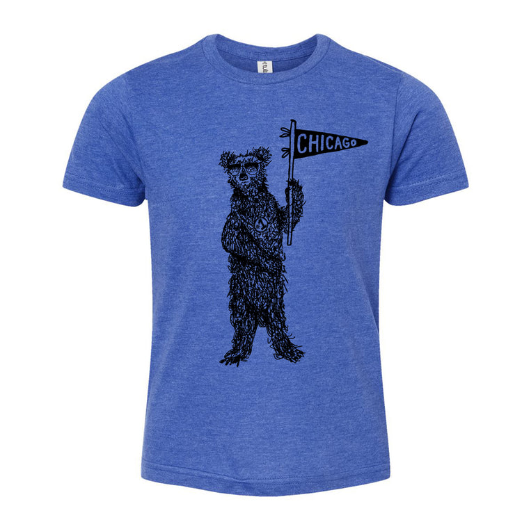 A blue t-shirt with a graphic design of a bear holding a Chicago flag.